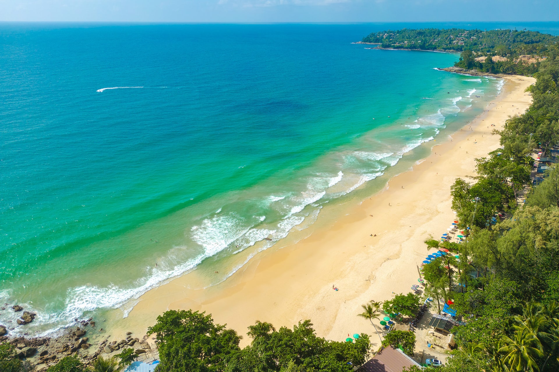 Aerial view of the golden sand and turquoise water at Surin Beach